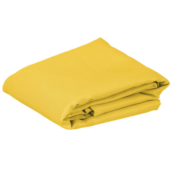 A folded yellow rectangular Intedge table cover.