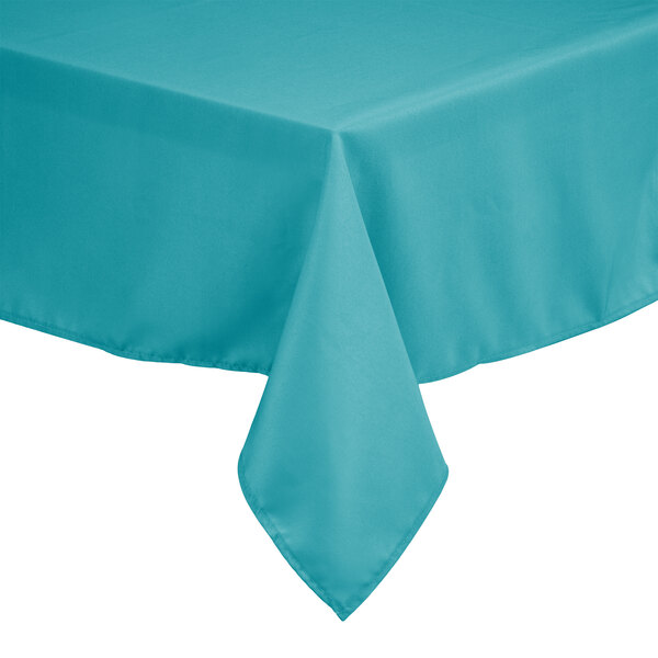 A teal Intedge square table cover on a table.