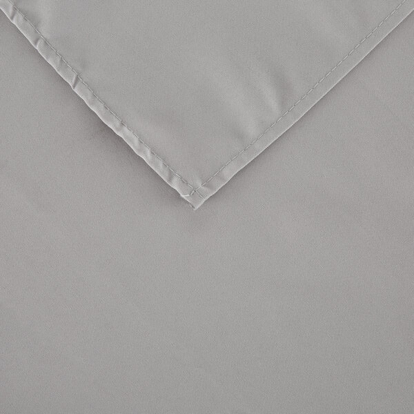 A close-up of a gray cloth with a folded edge.