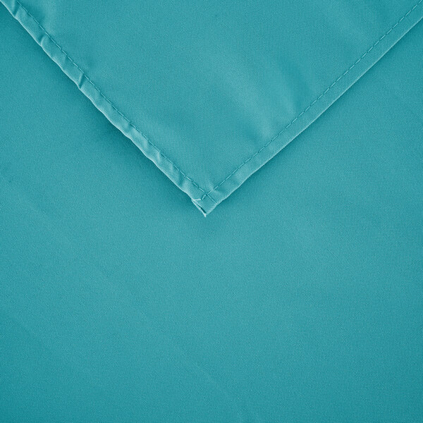 A teal rectangular cloth table cover with a folded edge.