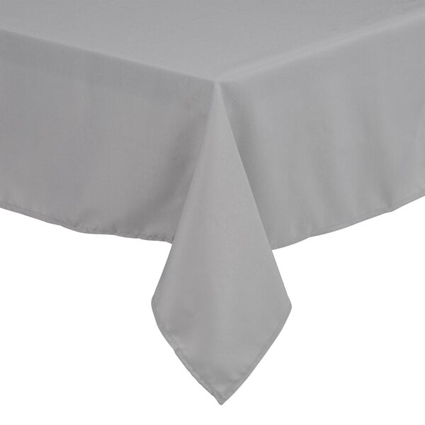 A gray rectangular tablecloth with hemmed edges on a table.