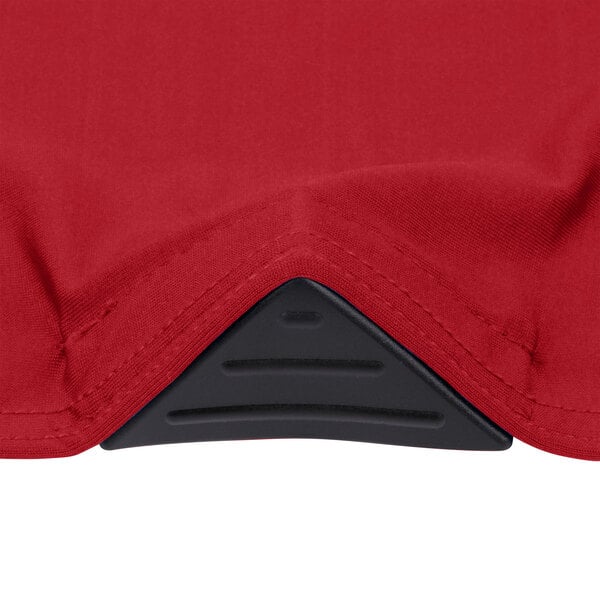 A crimson Snap Drape spandex table cover on a table.