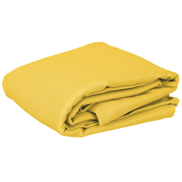 A stack of yellow folded Intedge rectangular table covers on a white background.