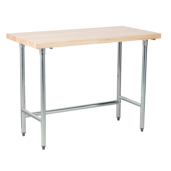 An Advance Tabco wood top work table with a galvanized metal base.