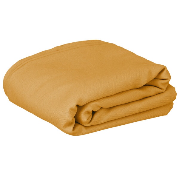 A folded rectangular gold table cover with hemmed edges.