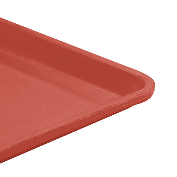 A close-up of a raspberry cream Cambro dietary tray.