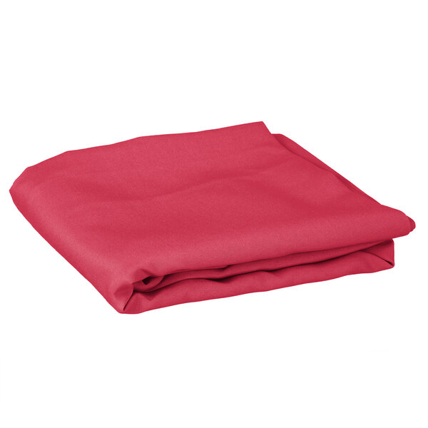 A folded hot pink Intedge table cover.