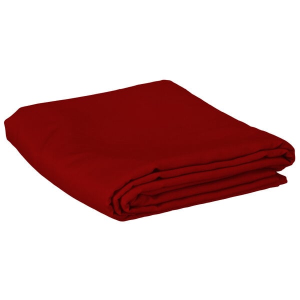 A folded red Intedge rectangular table cover.