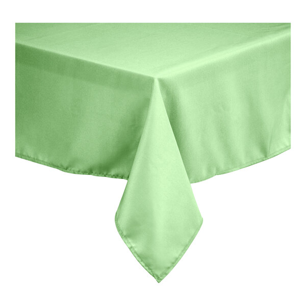 A square seafoam green polyester table cover with hemmed edges.