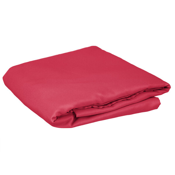 A folded hot pink Intedge table cover.