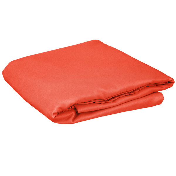 An orange Intedge cloth table cover folded on a white background.