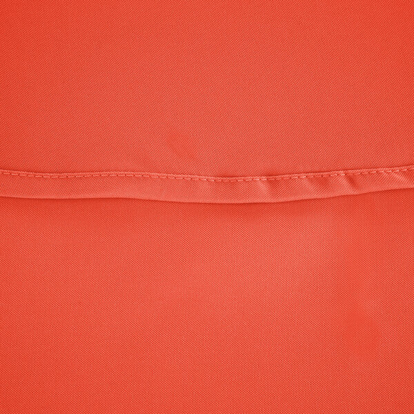 An orange hemmed cloth table cover.