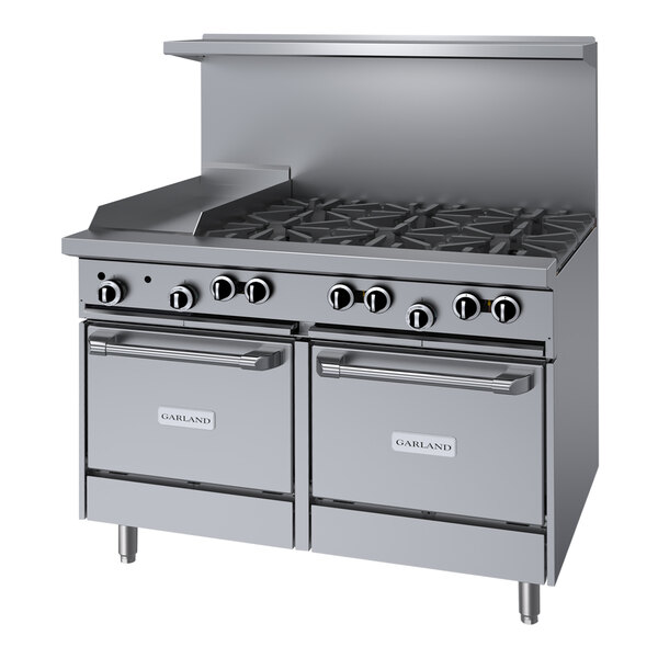 A stainless steel Garland commercial gas range with 6 burners and a griddle over two ovens.