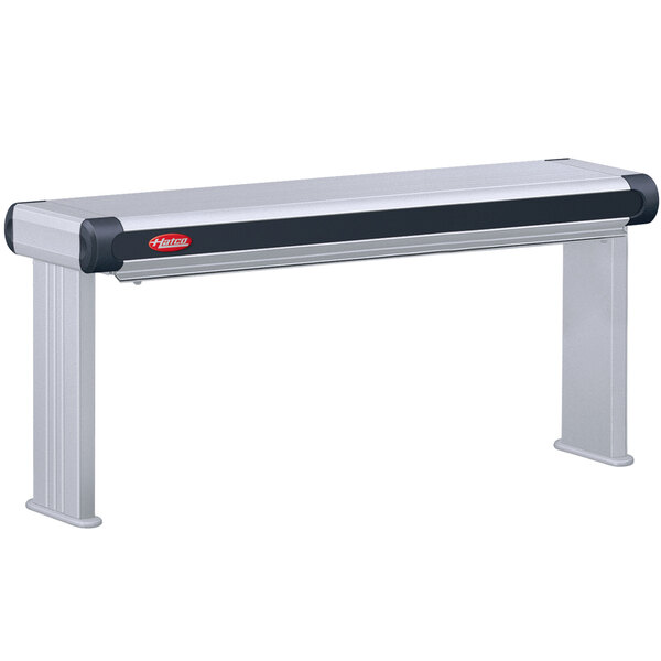 A rectangular metal Hatco strip warmer with black accents on a table.