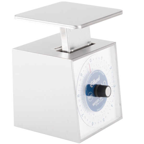 An Edlund silver mechanical portion scale with a blue dial.
