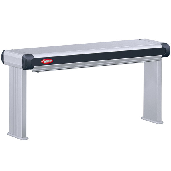 A Hatco decorative strip warmer with a black and red handle on a metal shelf.