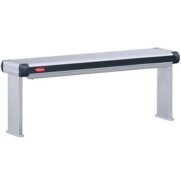 A Hatco stainless steel rectangular infrared strip warmer on a table with a black and red handle.