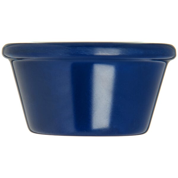 A close up of a Carlisle cobalt blue ramekin.