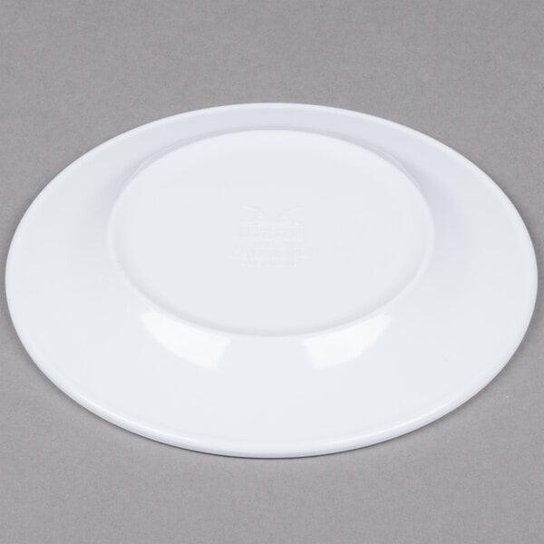 A white Minski melamine plate with a textured rim.