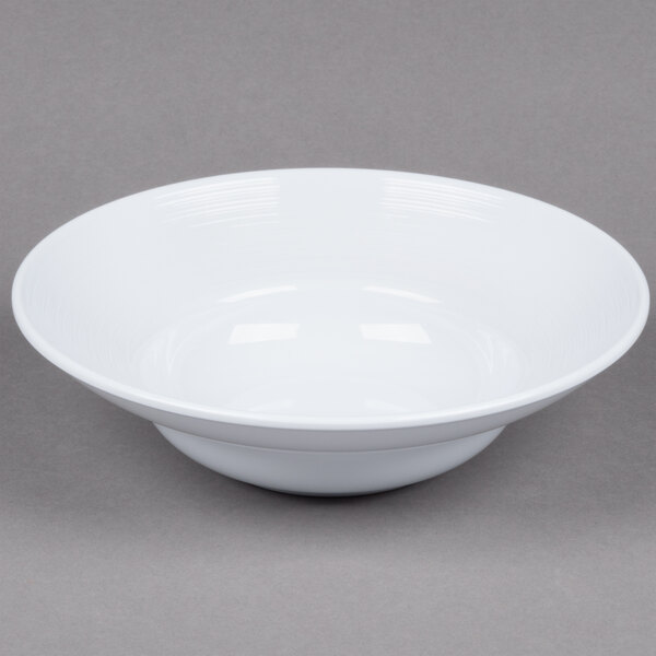 A white Minski melamine bowl with a textured rim.