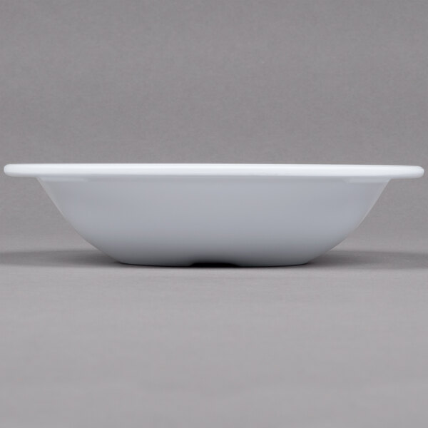 A white GET Centuria melamine bowl on a gray surface.