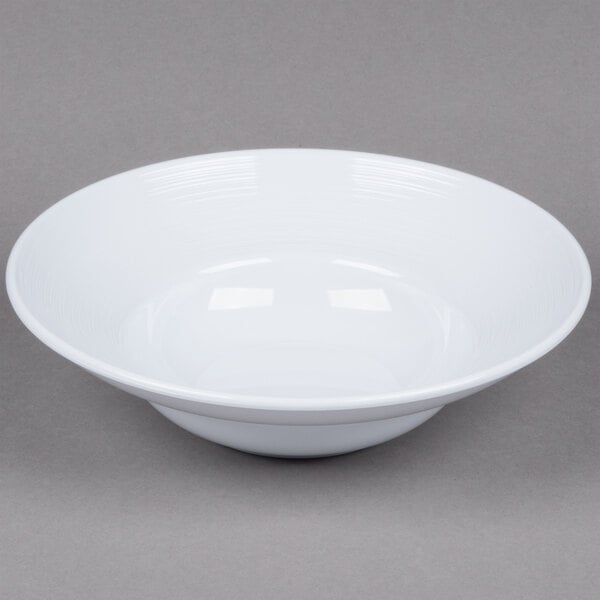 A white Minski melamine bowl with a textured rim.