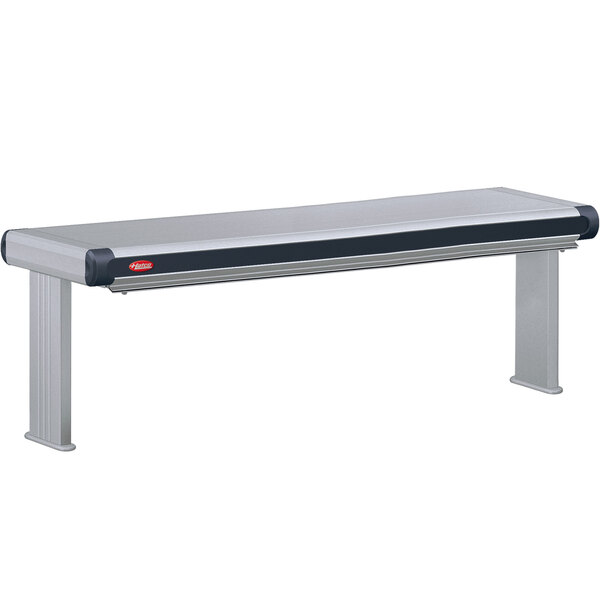 A long stainless steel Hatco strip warmer on a table with black and white accents.