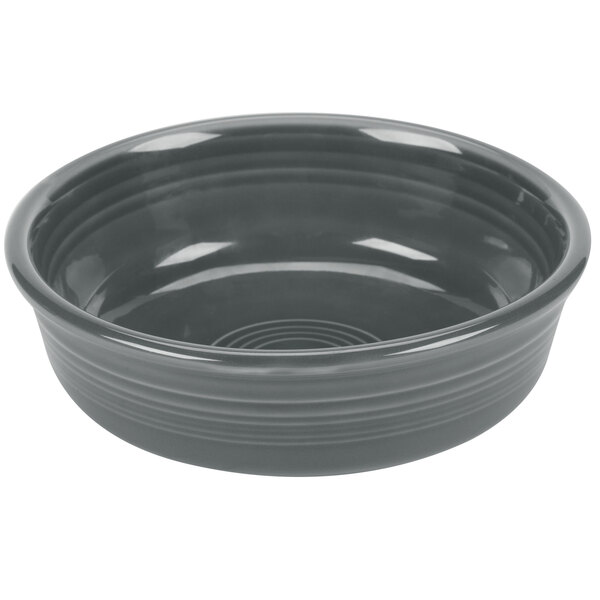 A grey bowl with a white background and a rim.