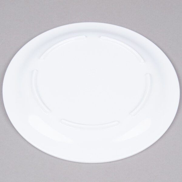 A white Thunder Group Nustone melamine plate with a narrow rim.