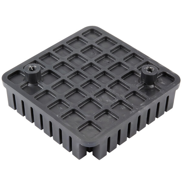 A black square plastic Nemco push block with holes.