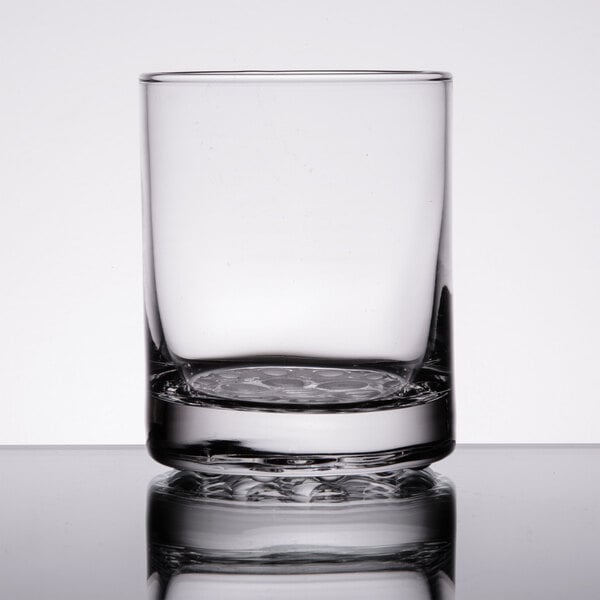 A close-up of a Libbey Nob Hill double old fashioned glass on a table.