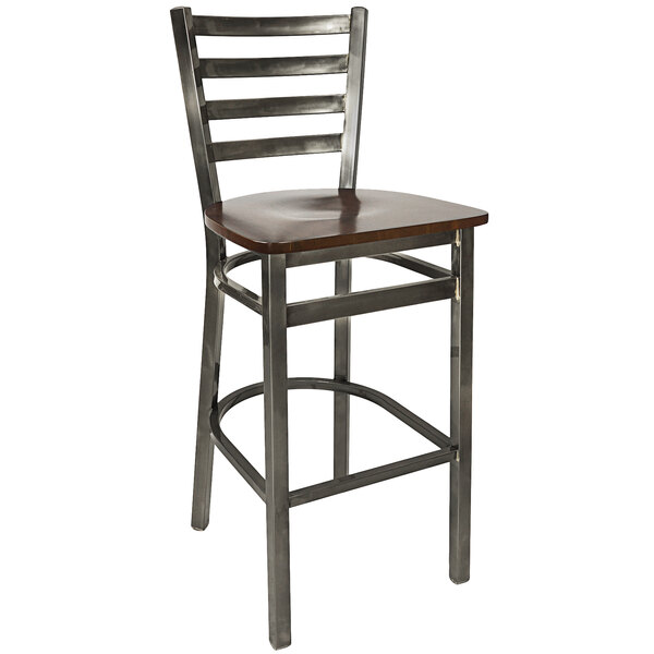 A BFM Seating metal bar stool with a walnut wooden seat.