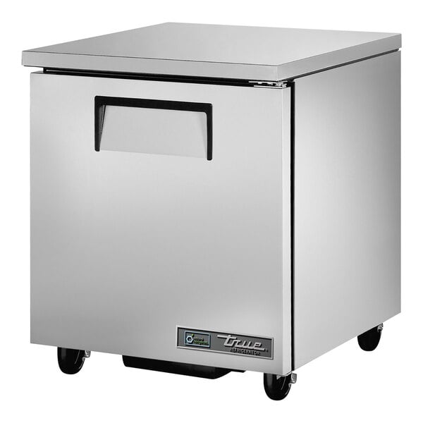 A silver True undercounter refrigerator with wheels.