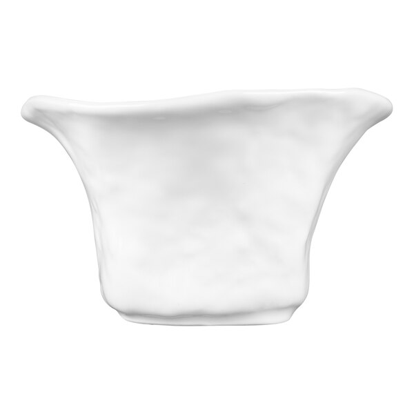 A bright white round porcelain bowl with an irregular shape and a square base.