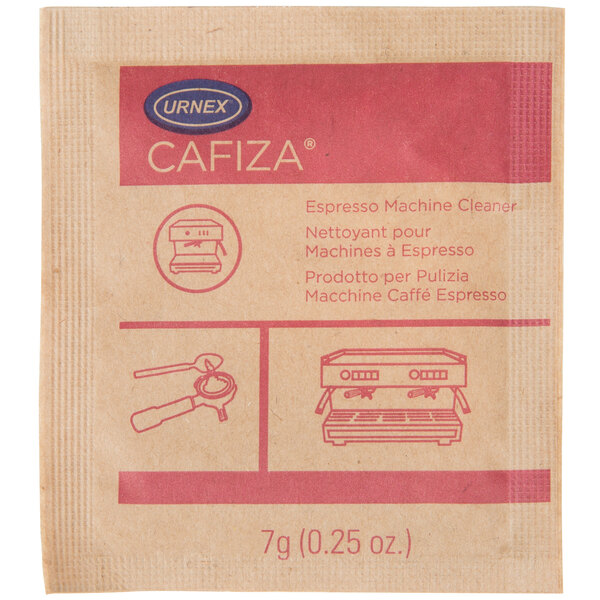 A brown and pink Urnex Cafiza packet on a counter next to a brown bag of coffee.