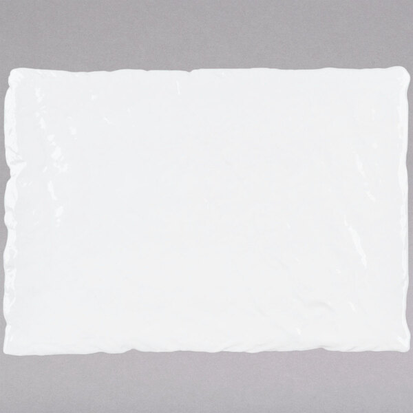 A white rectangular porcelain platter with a slate texture.