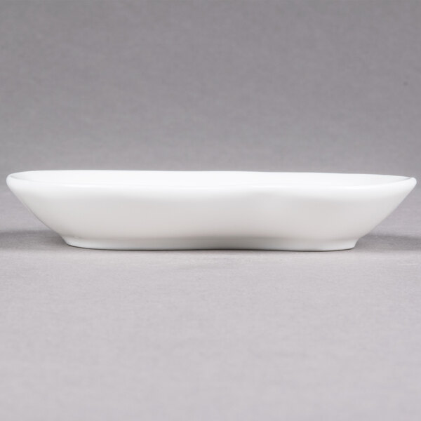 A white rectangular 10 Strawberry Street porcelain plate with curved edges.