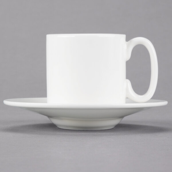 A 10 Strawberry Street white bone china espresso cup and saucer on a white saucer.
