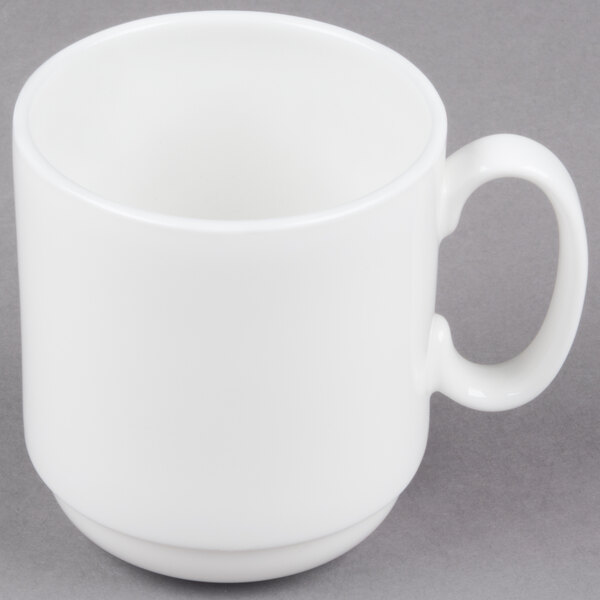 A 10 Strawberry Street Izabel Lam Pond white bone china espresso cup with a saucer on a gray surface.