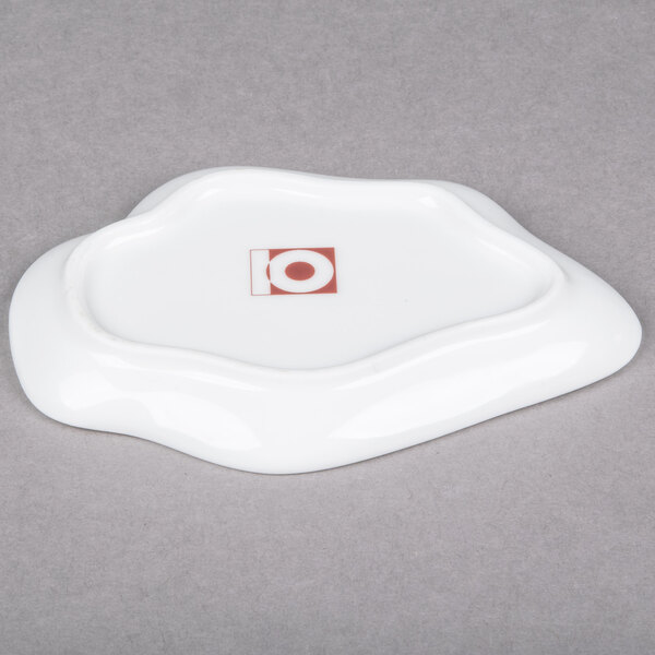 A white porcelain plate with a red logo on it.