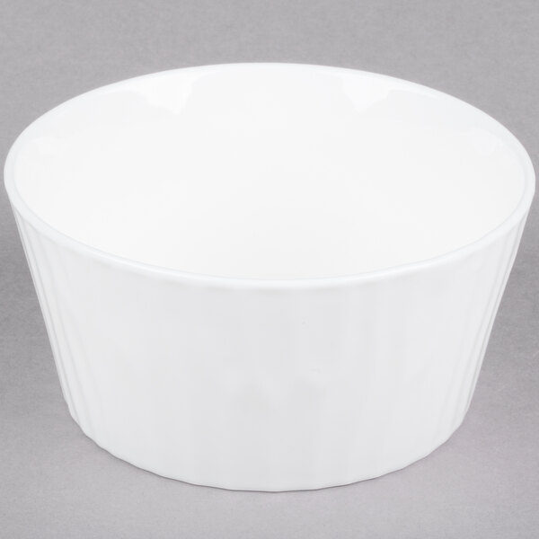 A white bowl with a rim on a gray surface.