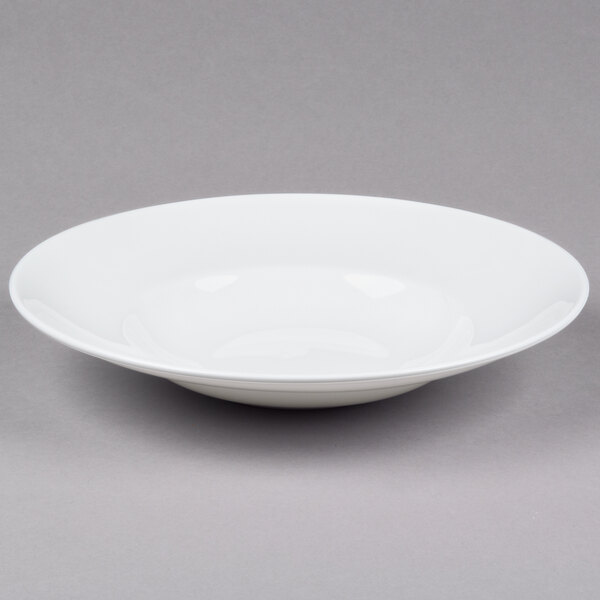 A 10 Strawberry Street white bone china bowl on a gray surface.