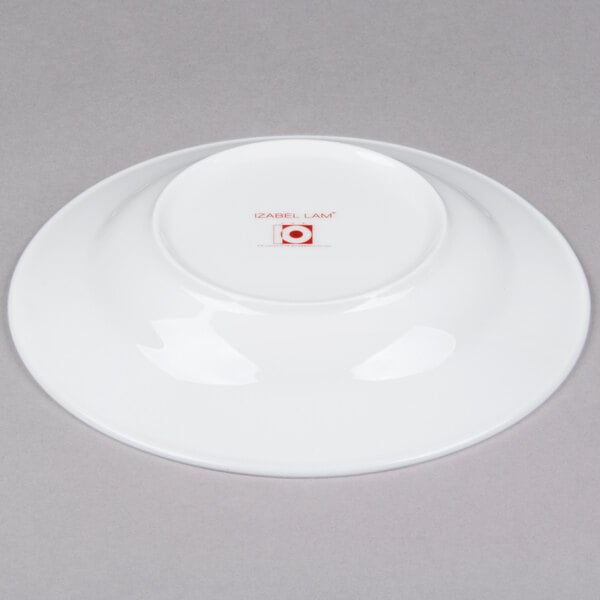 A white 10 Strawberry Street bone china wide rim soup bowl with a red logo.