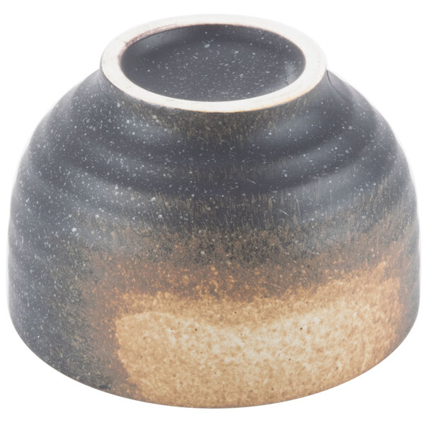 A black stoneware rice bowl with a brown rim.