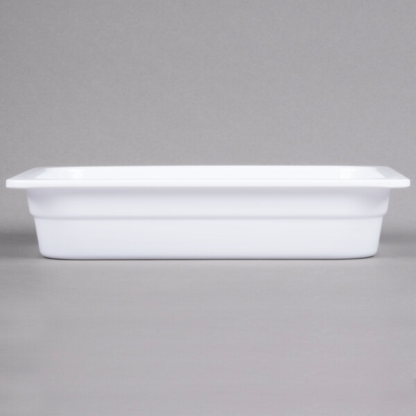 A white rectangular Thunder Group food pan with a white surface.