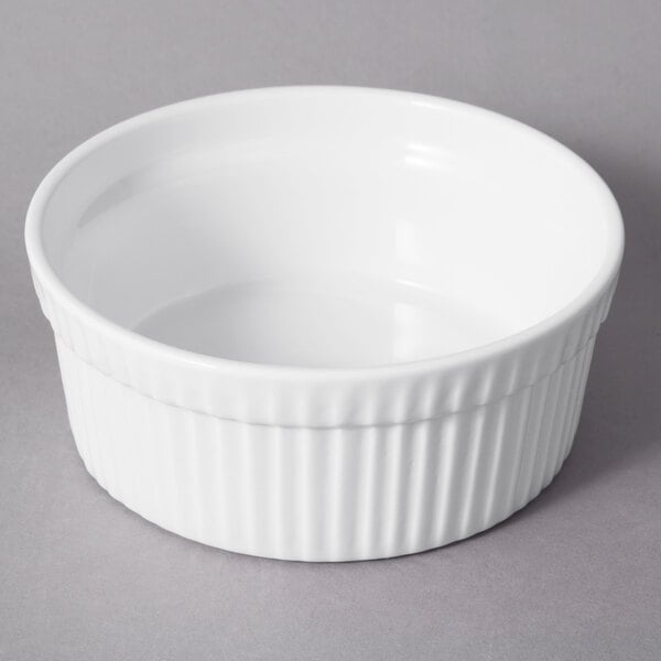 A white porcelain fluted ramekin with a ribbed rim.