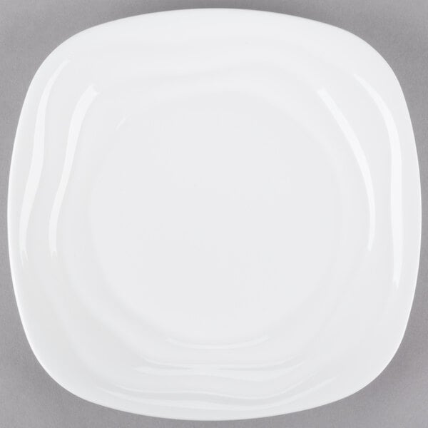 A 10 Strawberry Street bright white square porcelain side plate with a wavy design.