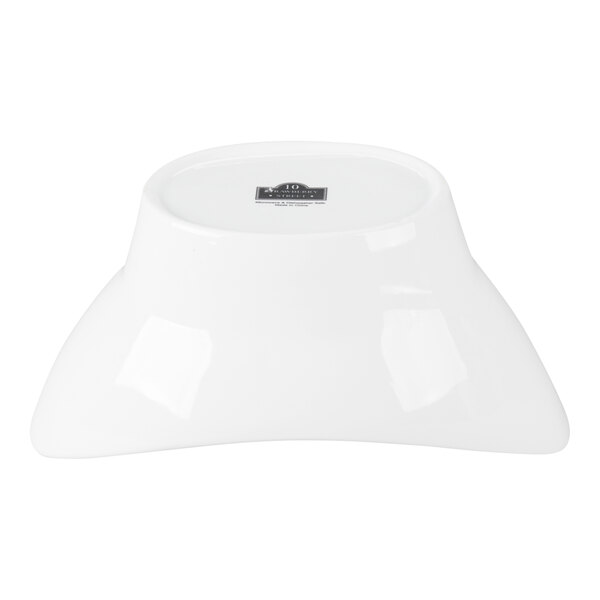 A white oval porcelain bowl turned upside down.