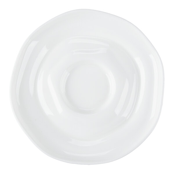 A bright white porcelain saucer with a rippled design.