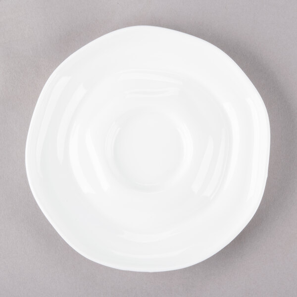 A 10 Strawberry Street bright white porcelain saucer with a small rim.
